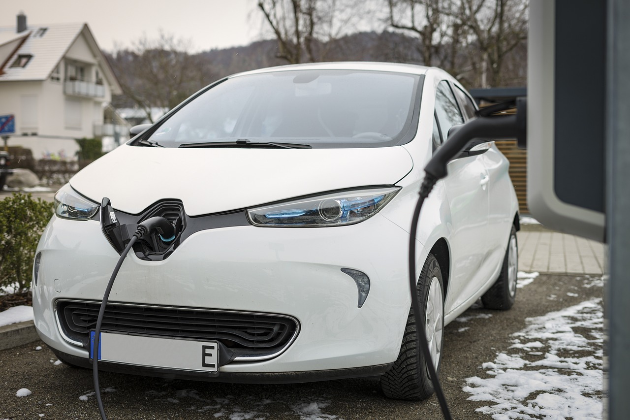 An electric car is charged by a level 2 commercial EV charger.